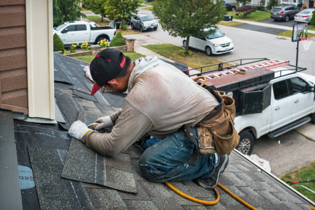 Professional Storm Damage Roof Repair technician working in West Point, TX